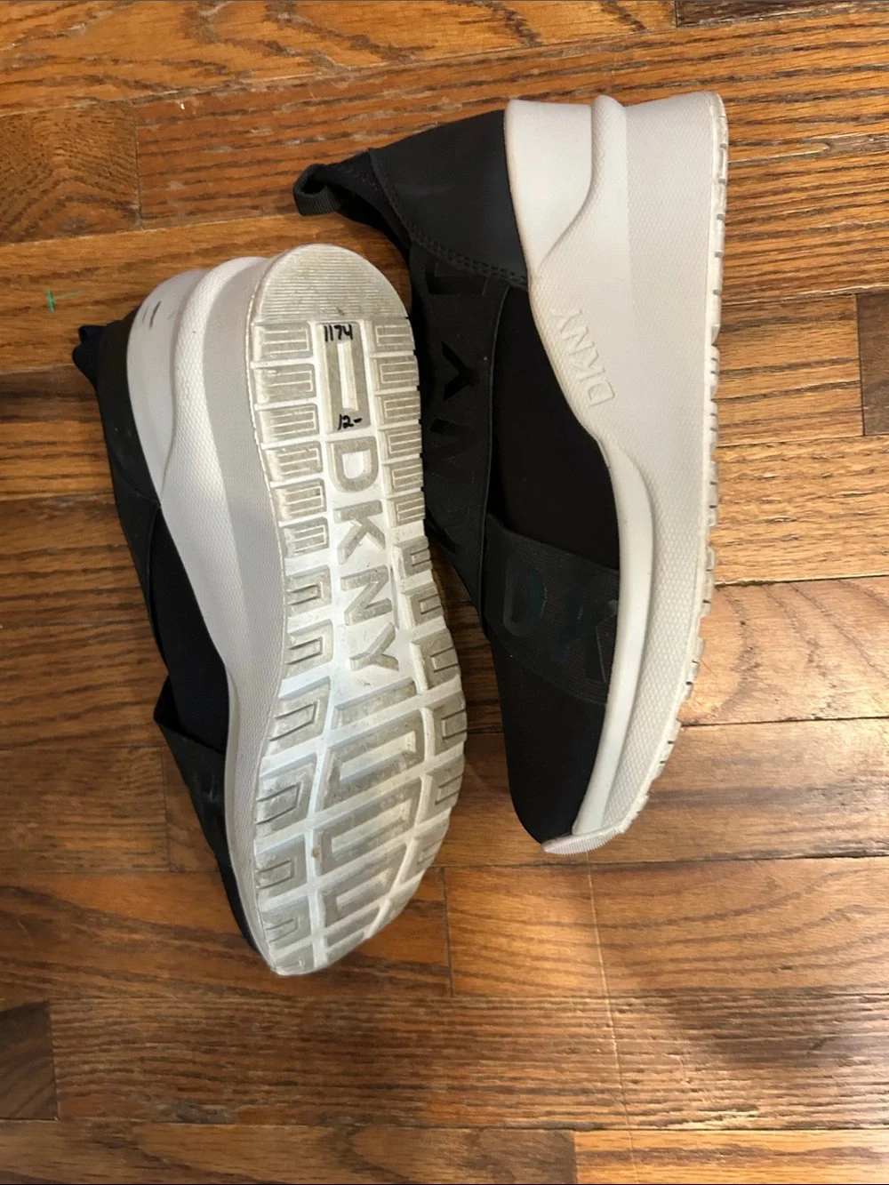 DKNY Black Slip-On Logo-Trim Women’s Sneakers with White Sole